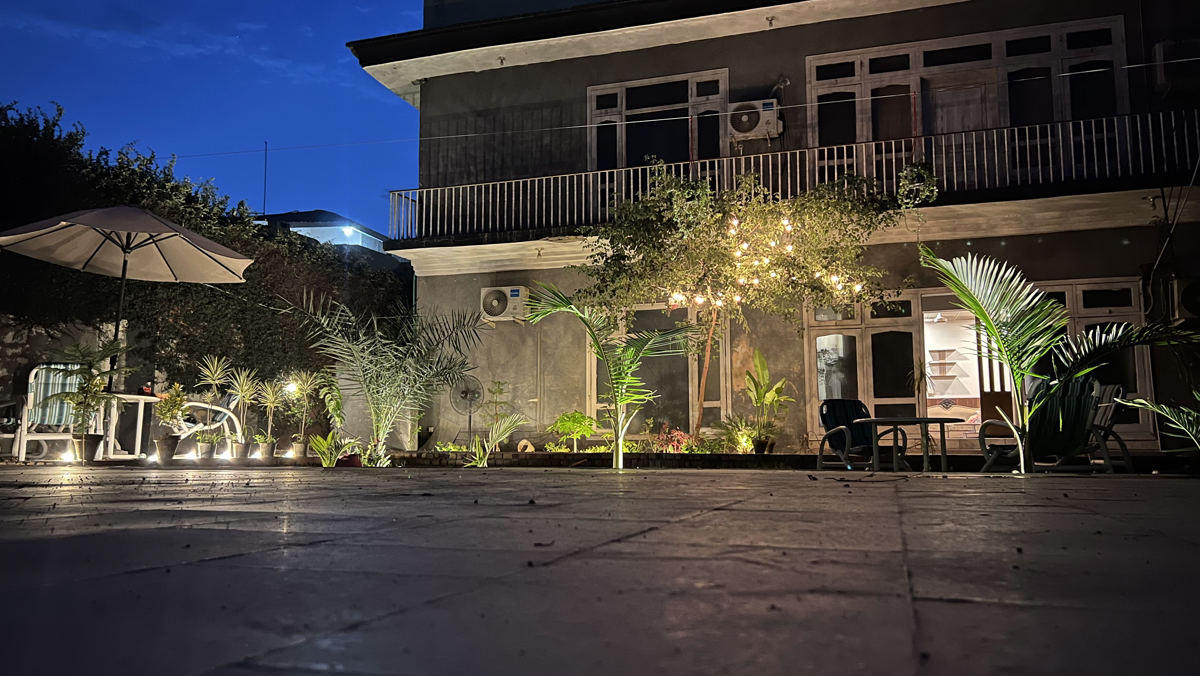 Courtyard lounge area lit up at dusk